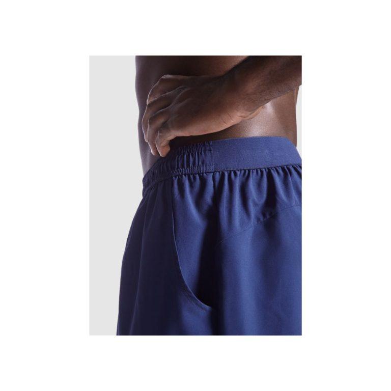 PANTALÓN DEPORTIVO · TEJIDO TRANSPIRABLE · POLIÉSTER RECICLADO · 0306 MARINO FRONT